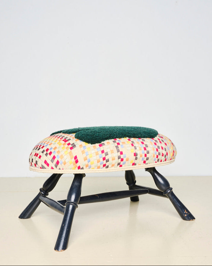 Upcycled footstool with tufted embellishments, font view 