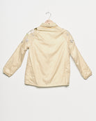 Upcycled windbreaker with floral embroidery, back view. 