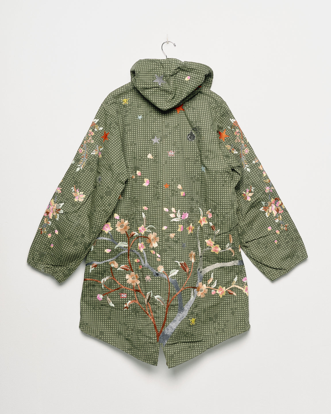Upcycled parka with floral embroidery, back view. 