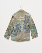 Vintage camouflage fatigue jacket with embroidered, back view.