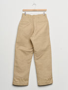Upcycled chinos with embroidery, back view. 