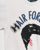 Upcycled sweatshirt with embroidery saying “hair force”, close up view. 