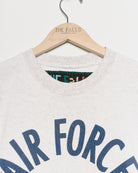 Upcycled sweatshirt with embroidery saying “hair force”, close up view. 