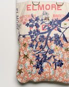Repurposed vintage feedback tote with embroidered florals, close up view. 