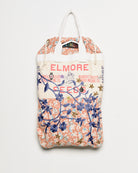 Repurposed vintage feedback tote with embroidered florals, back view. 