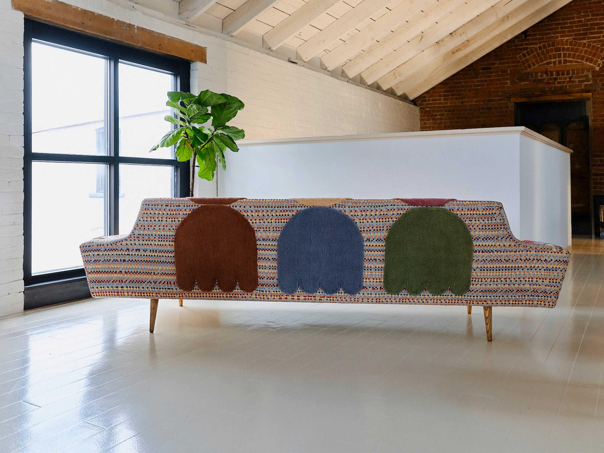 Upcycled sofa with tufted embellishments, back view 