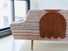 Upcycled sofa with tufted embellishments, close up view 