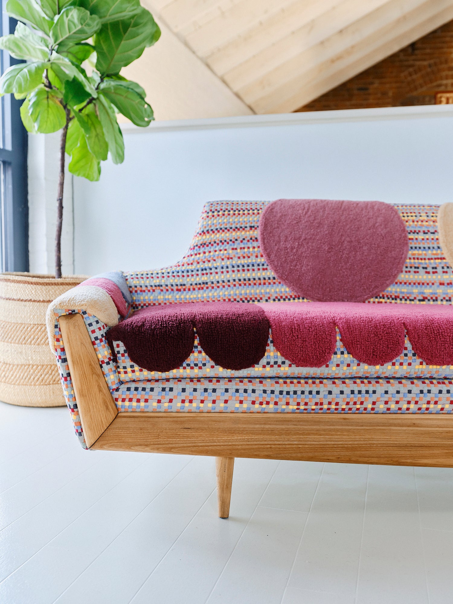 Upcycled sofa with tufted embellishments, close up view 