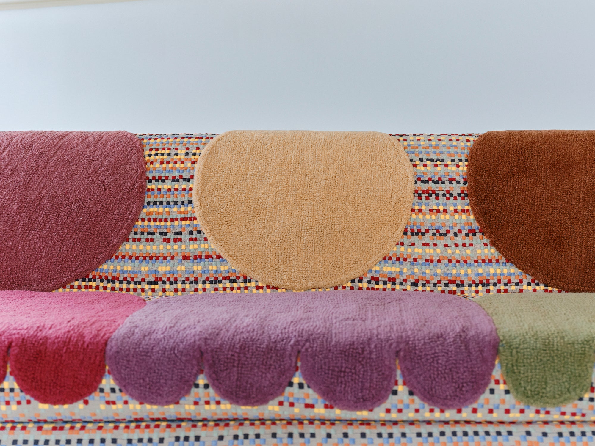 Upcycled sofa with tufted embellishments, close up view 