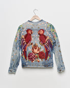 Vintage denim jacket with embroidery and tufted motifs, back view. 