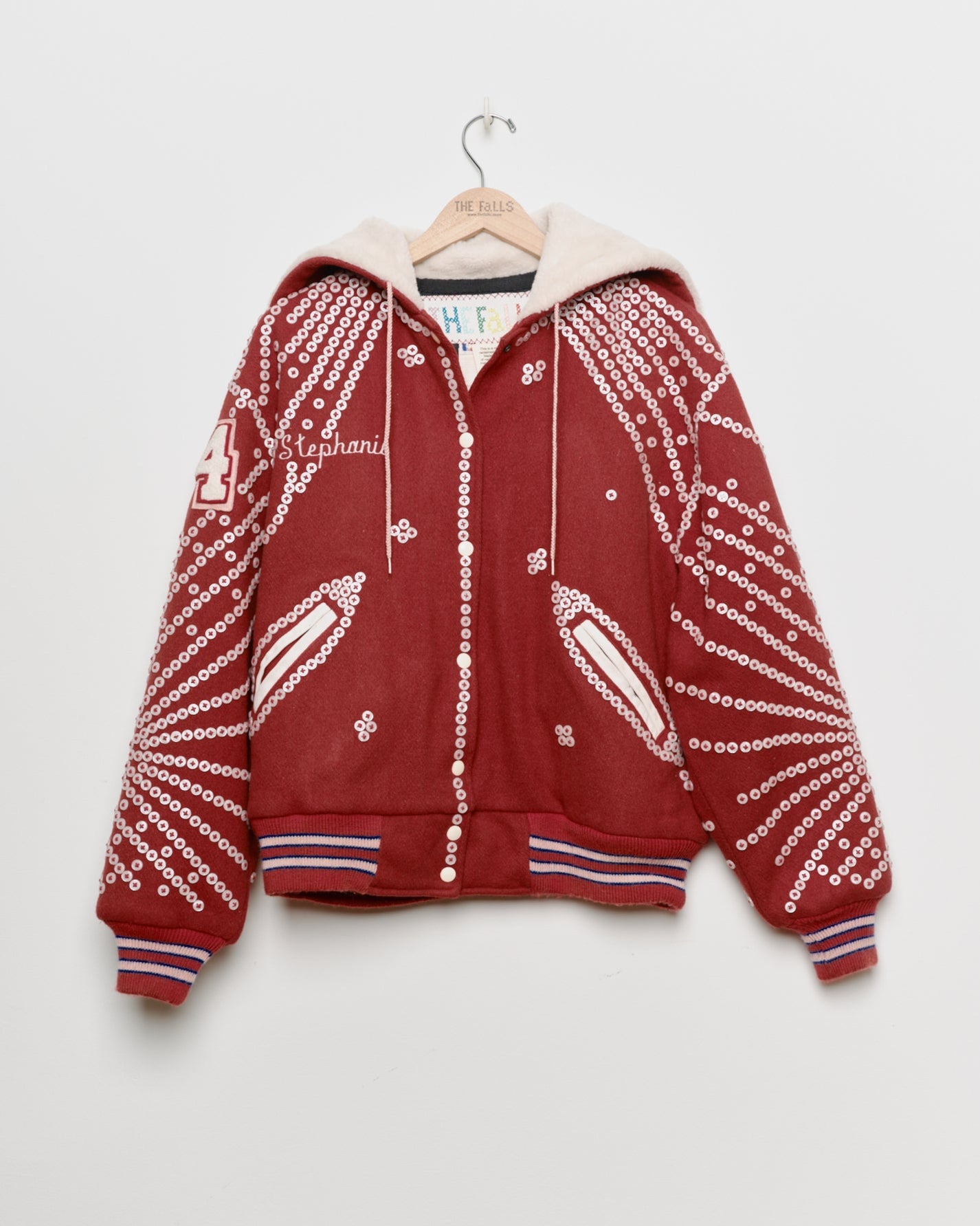 Red upcycled jacket with pearly buttons, front view. 
