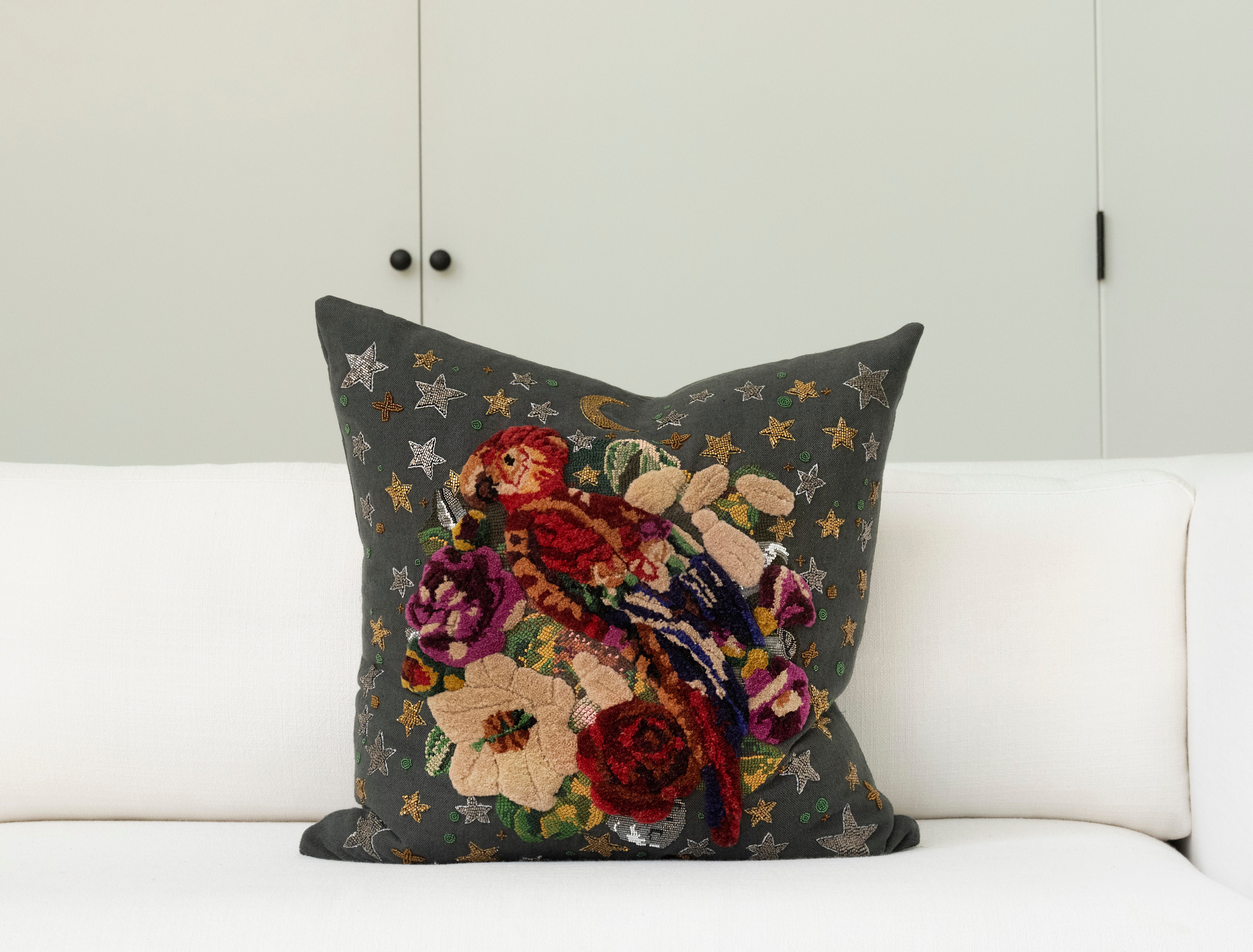 Pillow with tufted embellishments, font view 