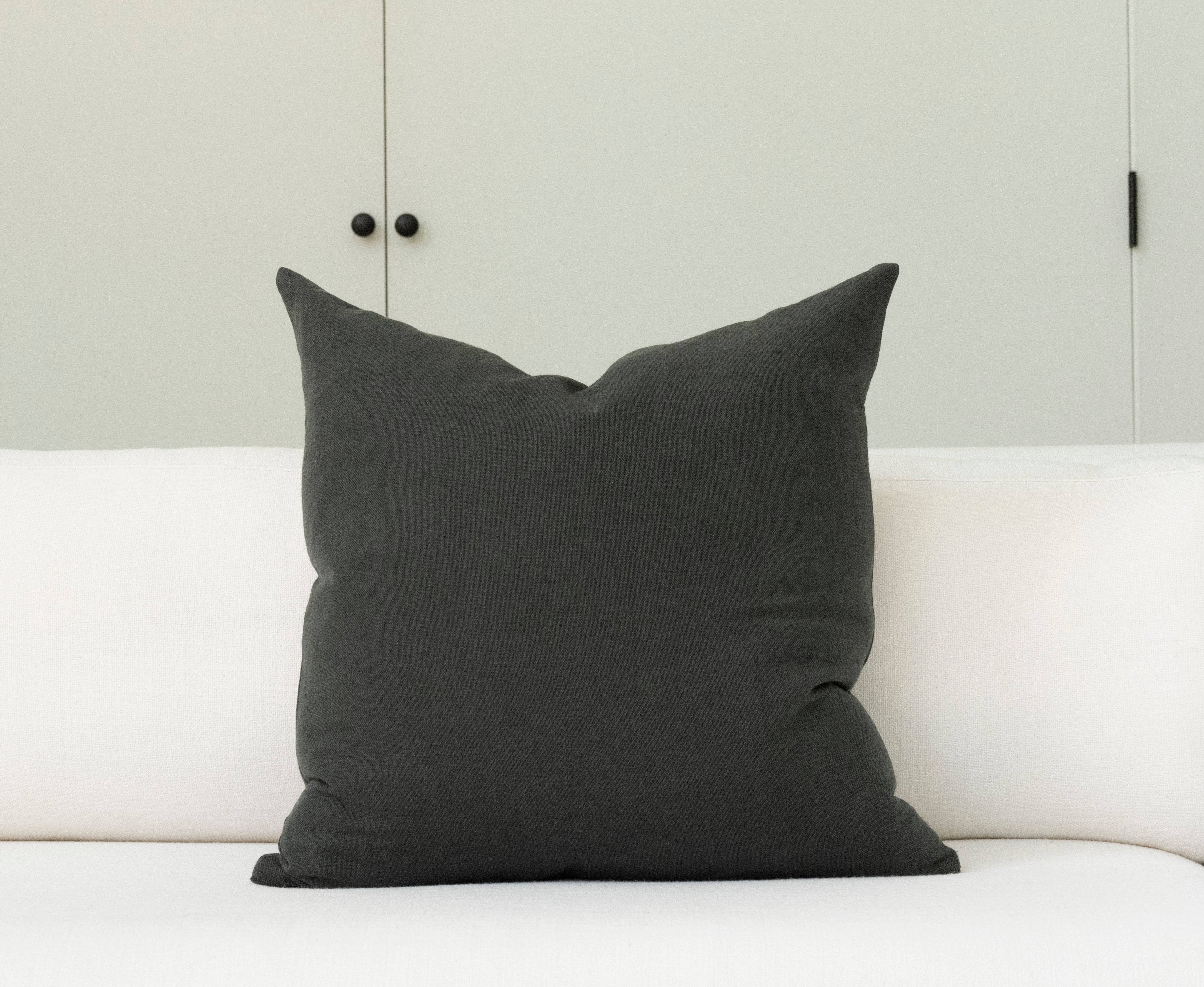 Pillow with tufted embellishments, back view 