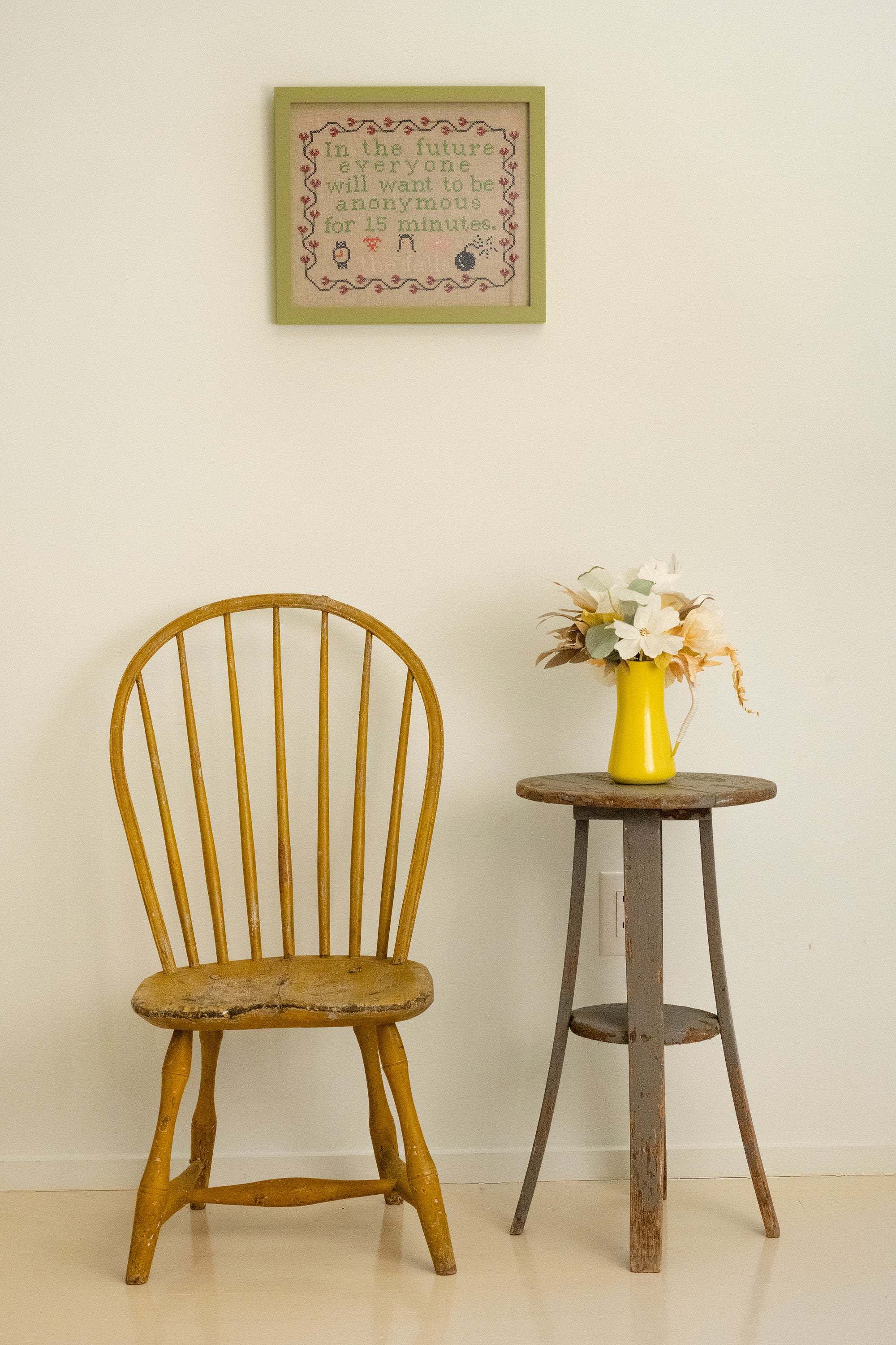 Upcycled framed sampler, room view 