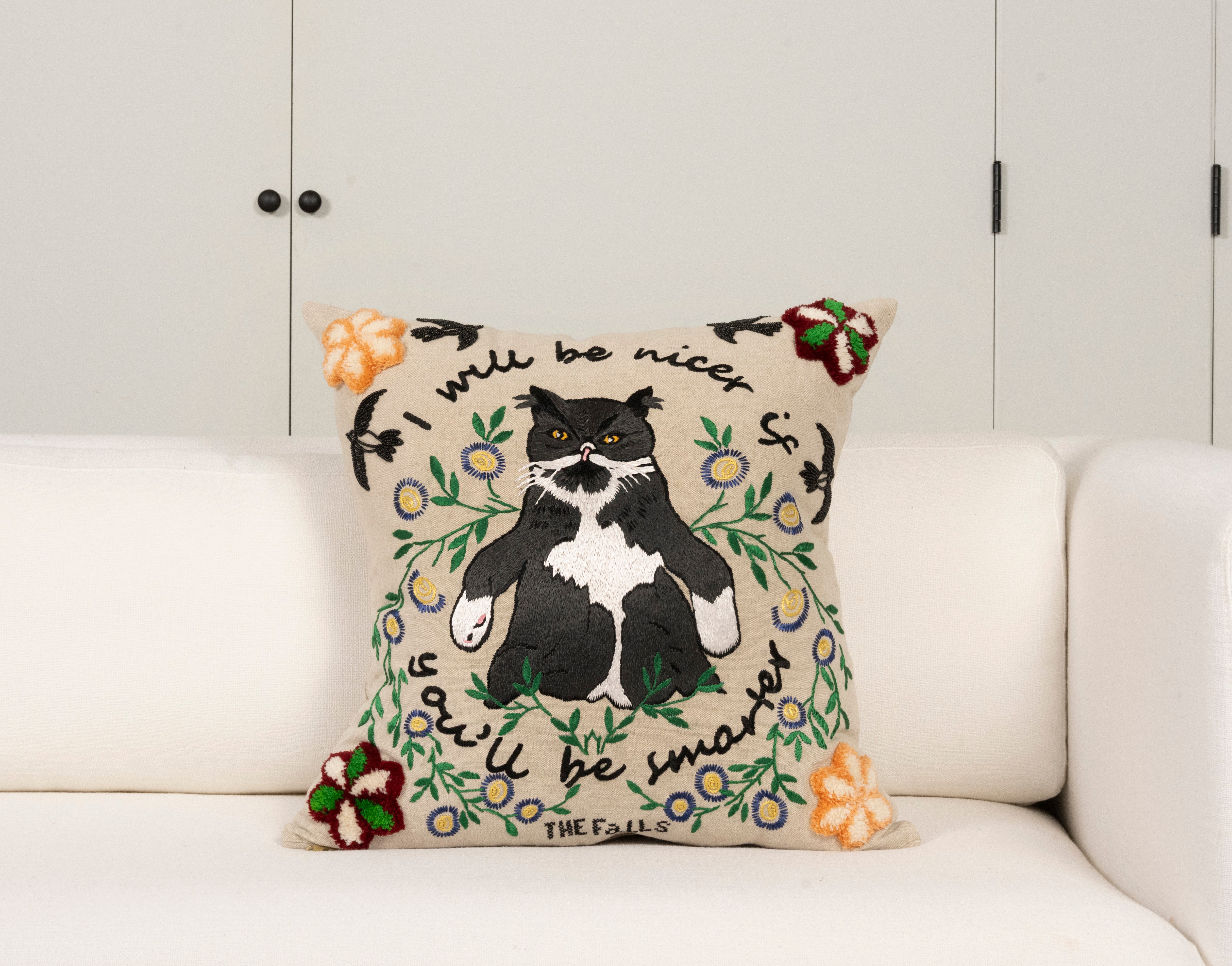 Pillow with embroidery embellishments, front view 