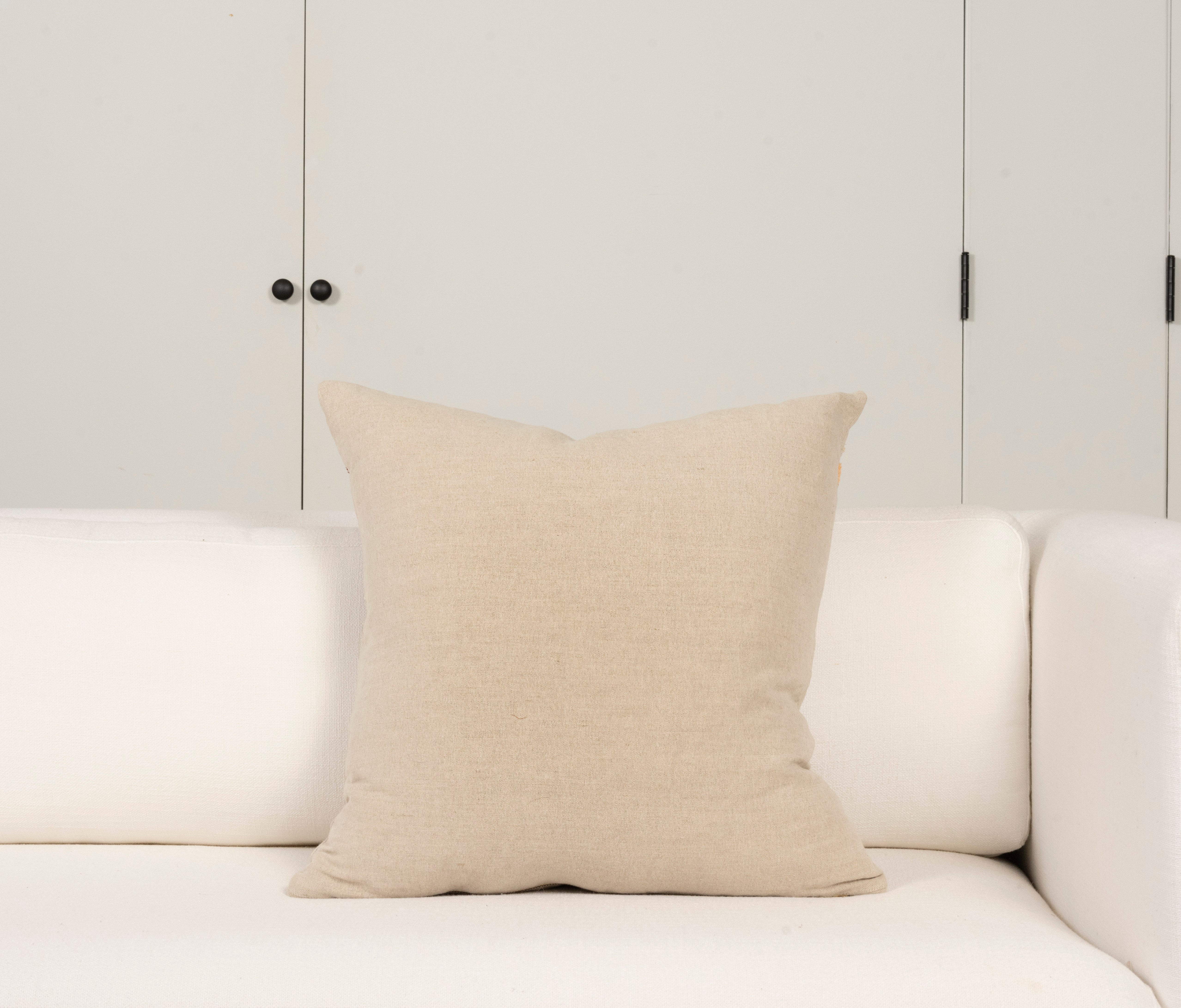 Pillow with embroidery embellishments, bottom view 