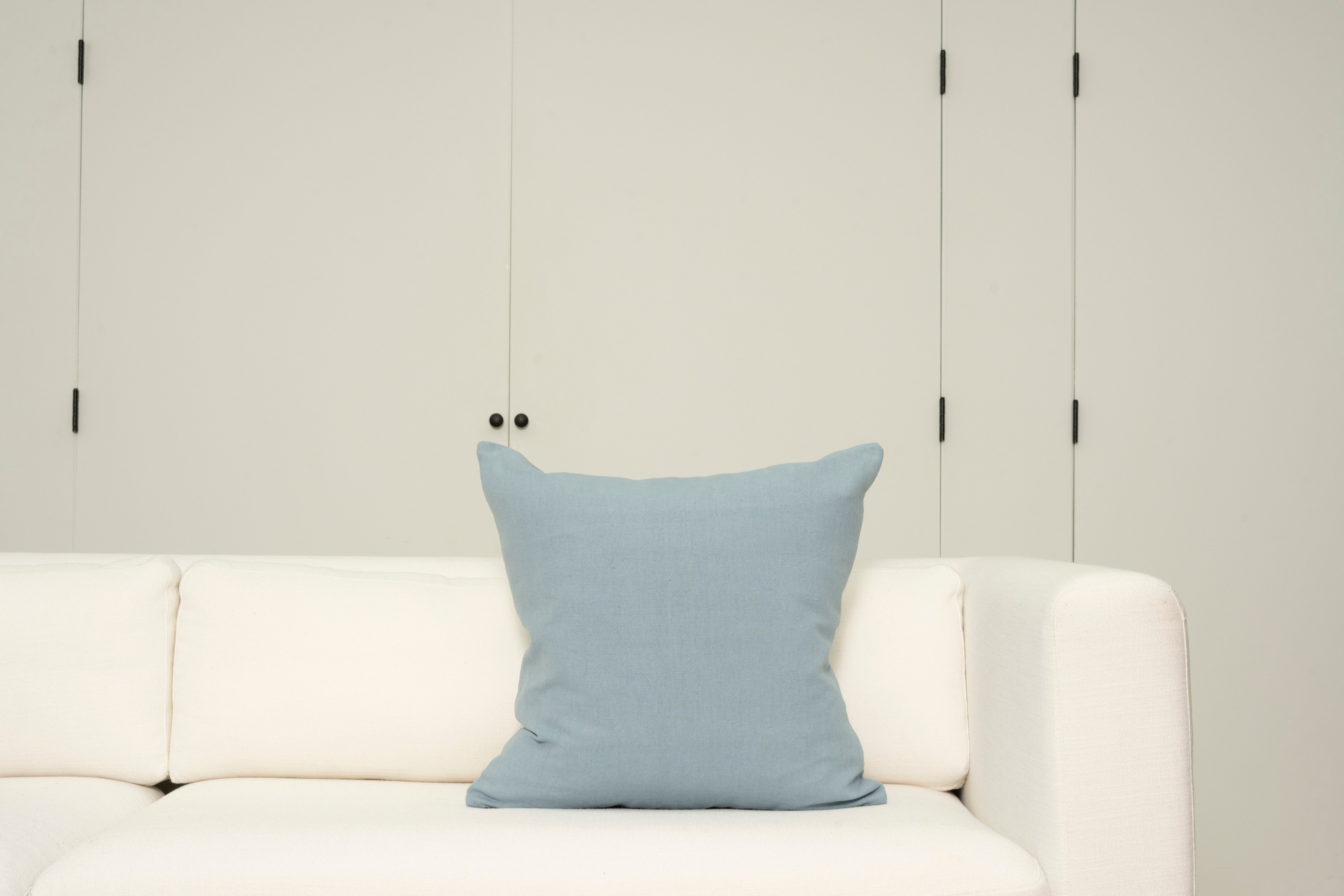 Pillow with embroidery embellishments, back view 