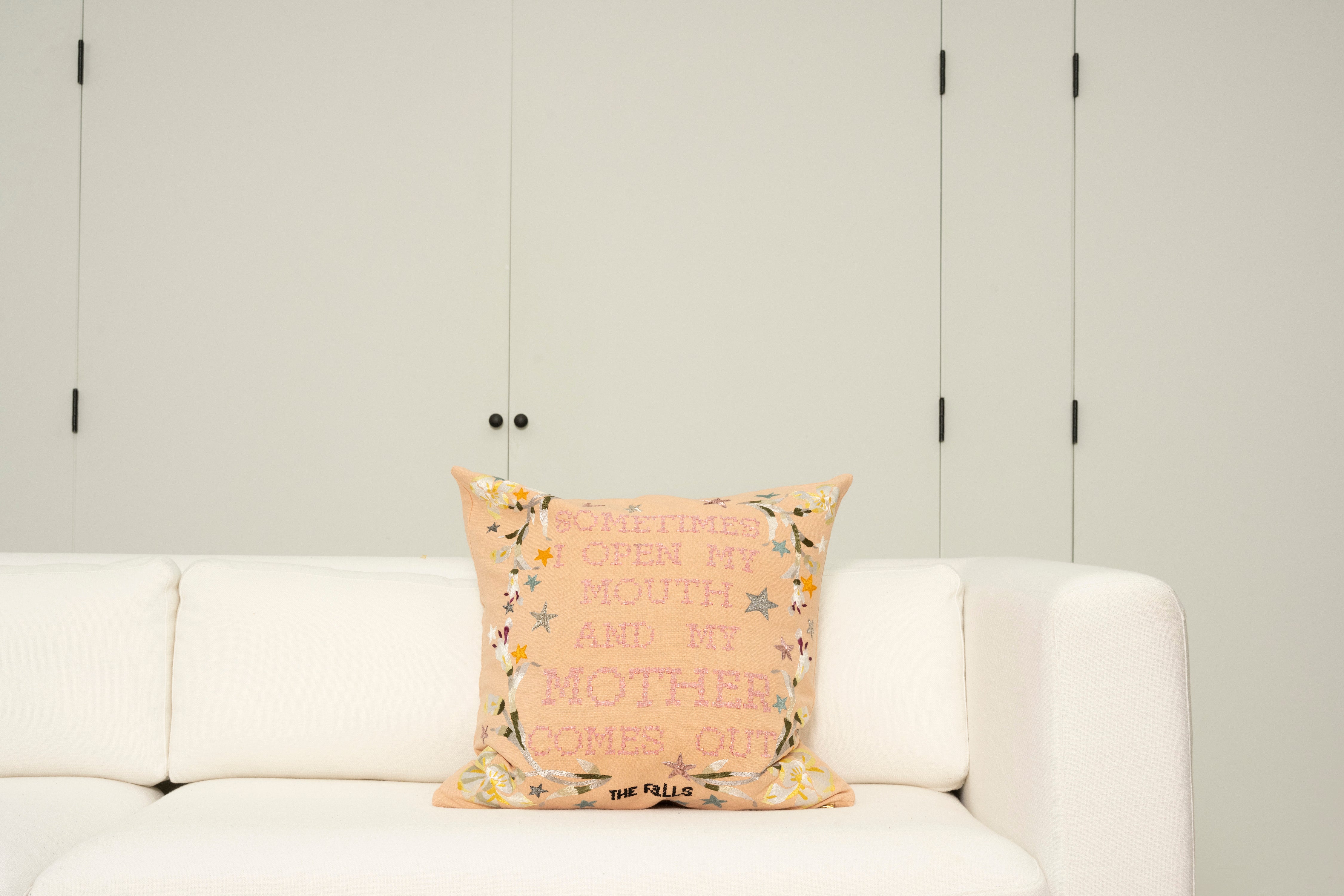 Pillow with embroidery embellishments, font view 