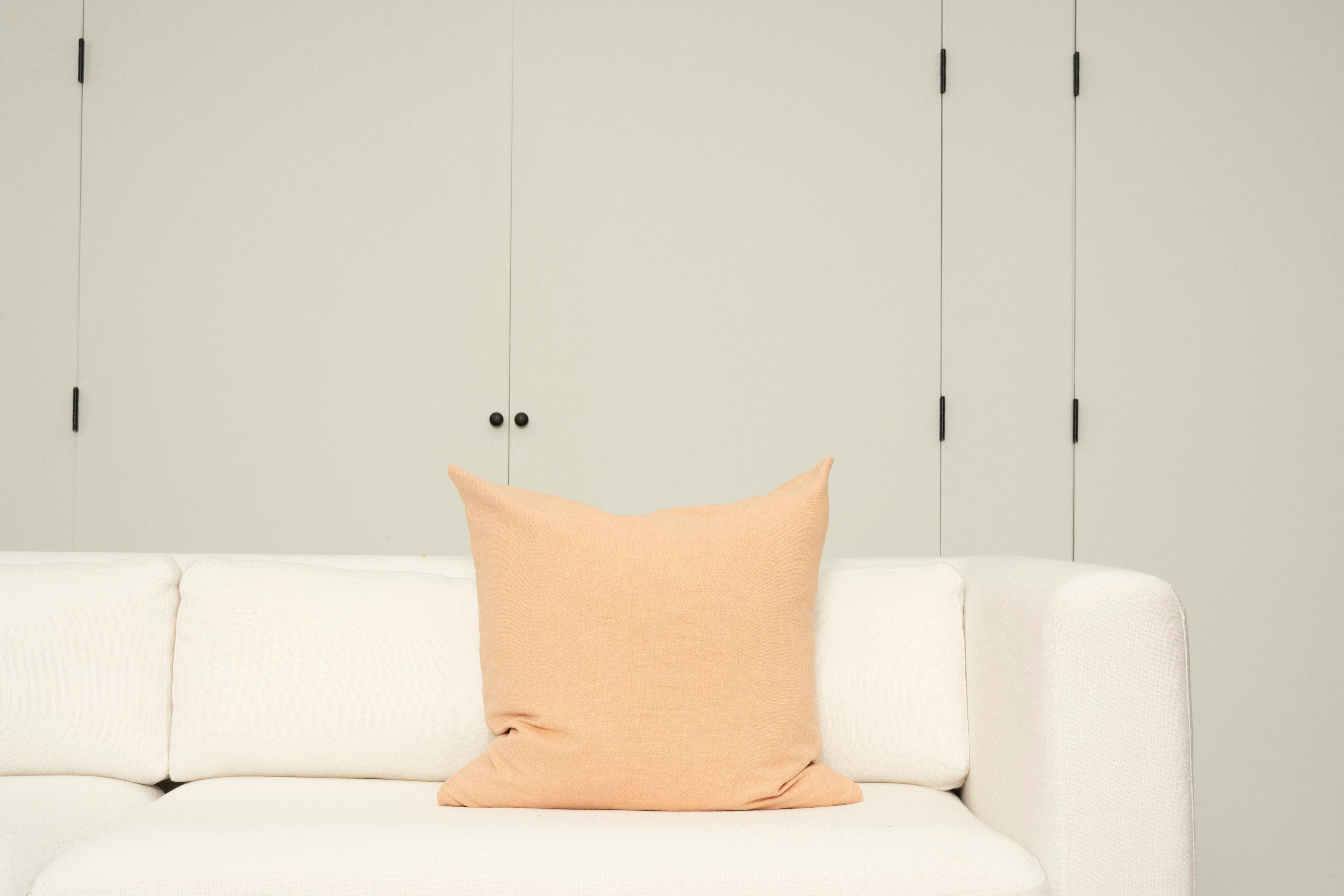 Pillow with embroidery embellishments, back view 