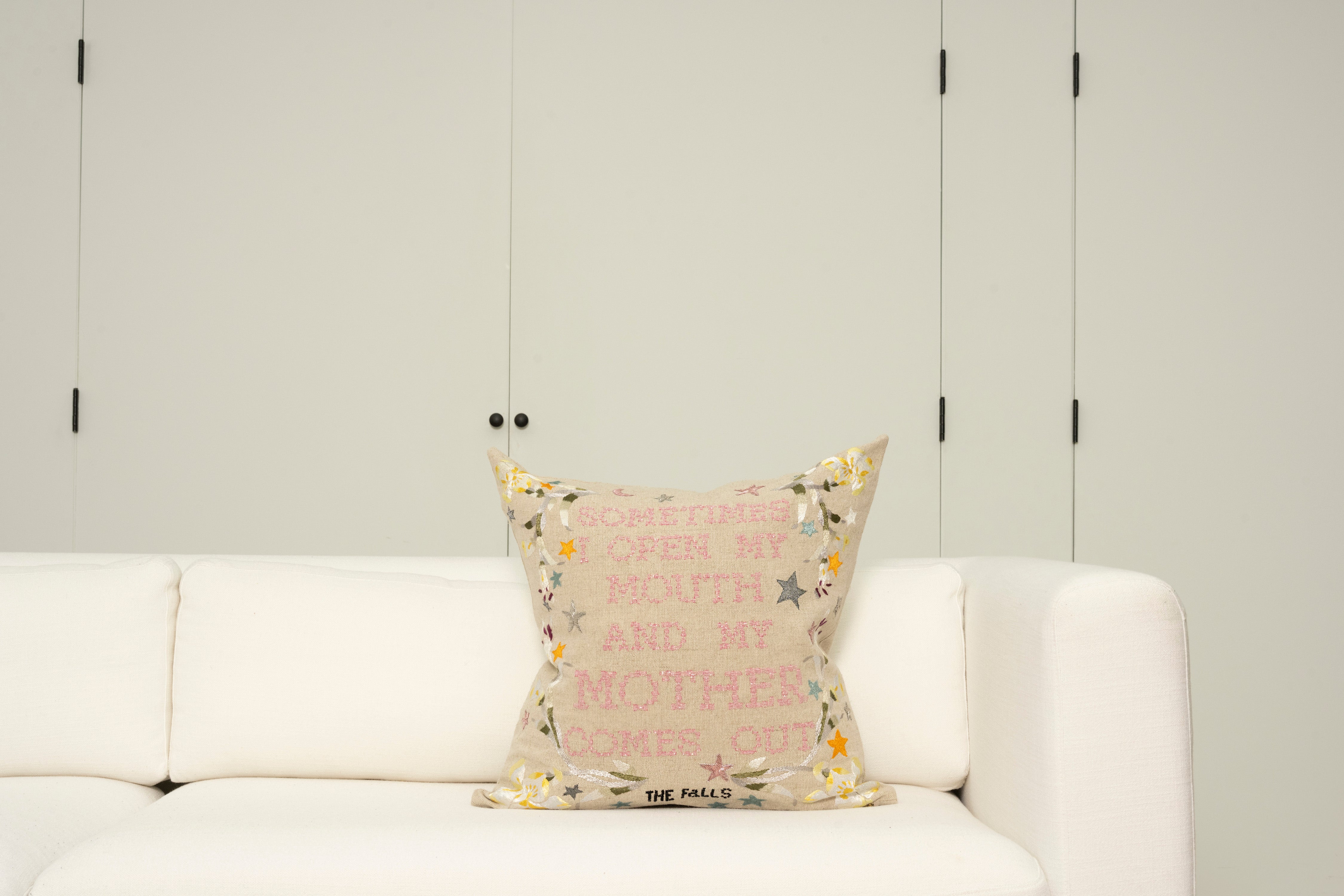Pillow with embroidery embellishments, font view 