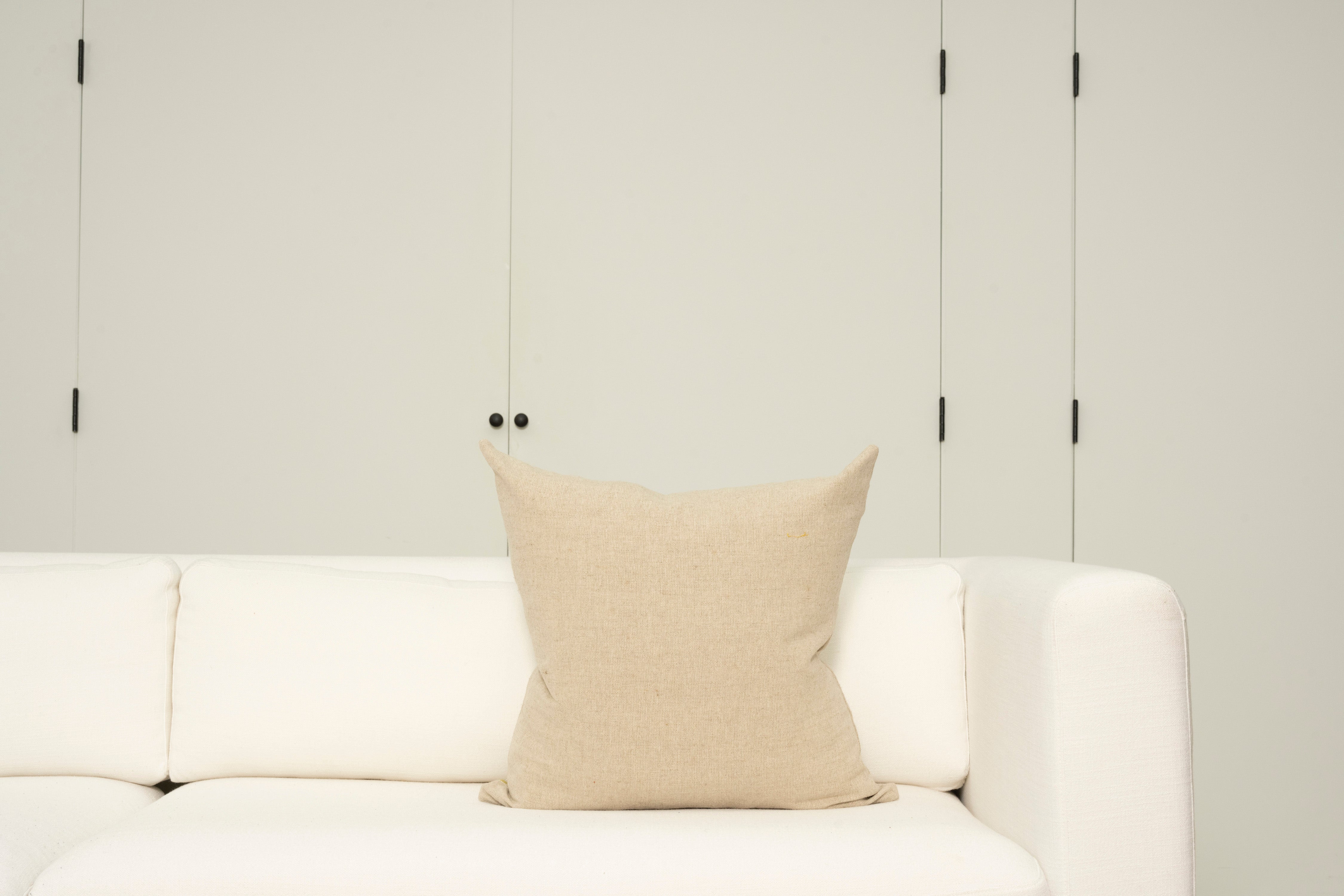 Pillow with embroidery embellishments, back view 