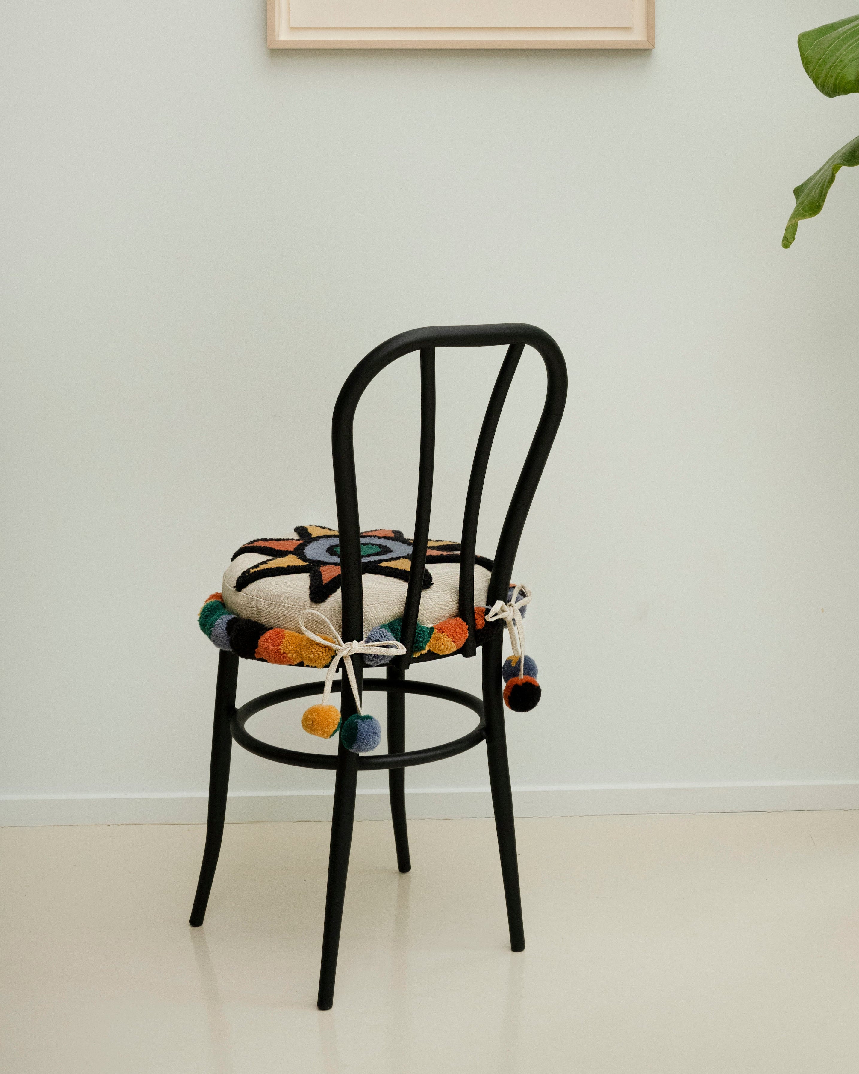 Upcycled chair with tufted embellishments, back view