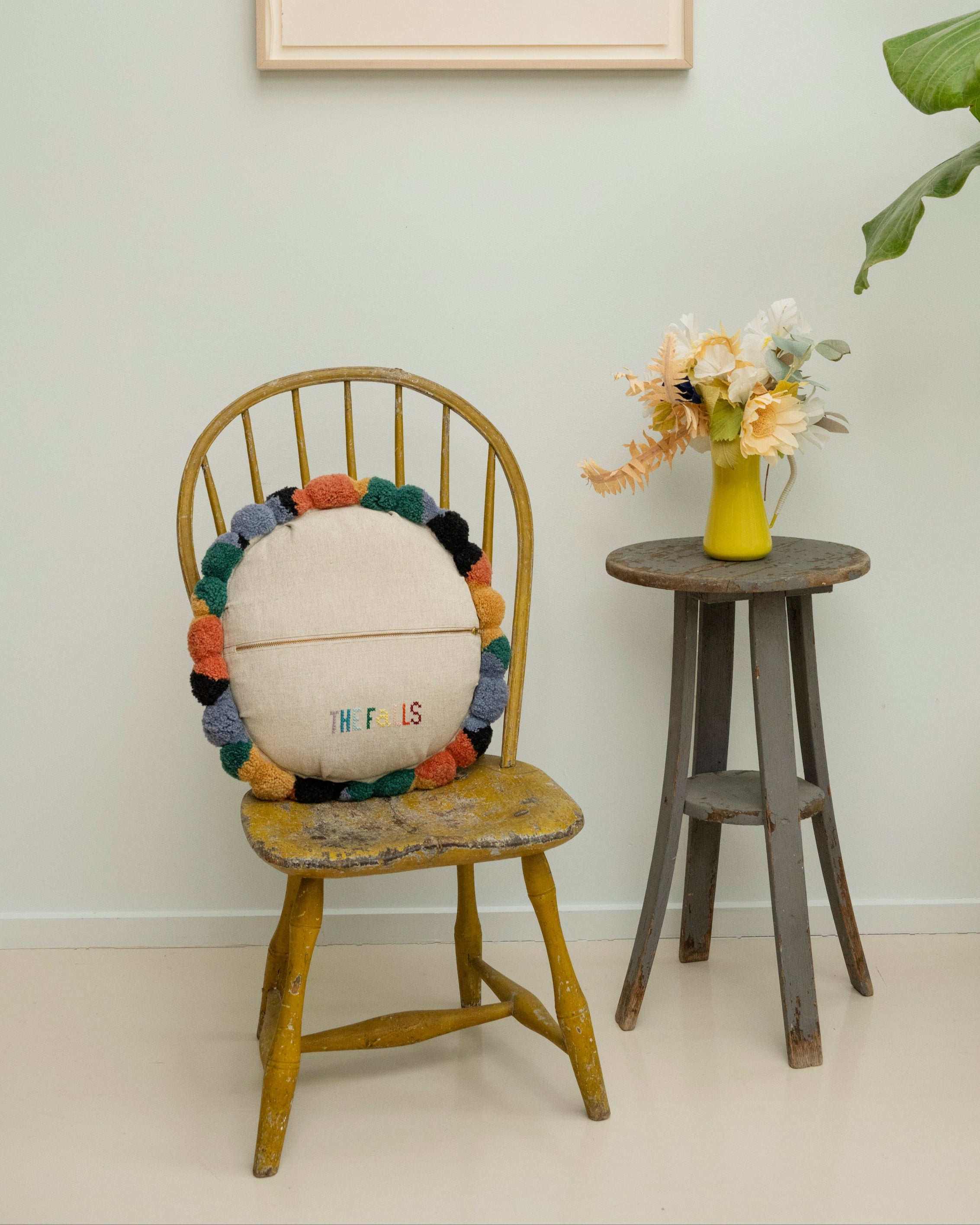 Pillow with tufted embellishments, back view 