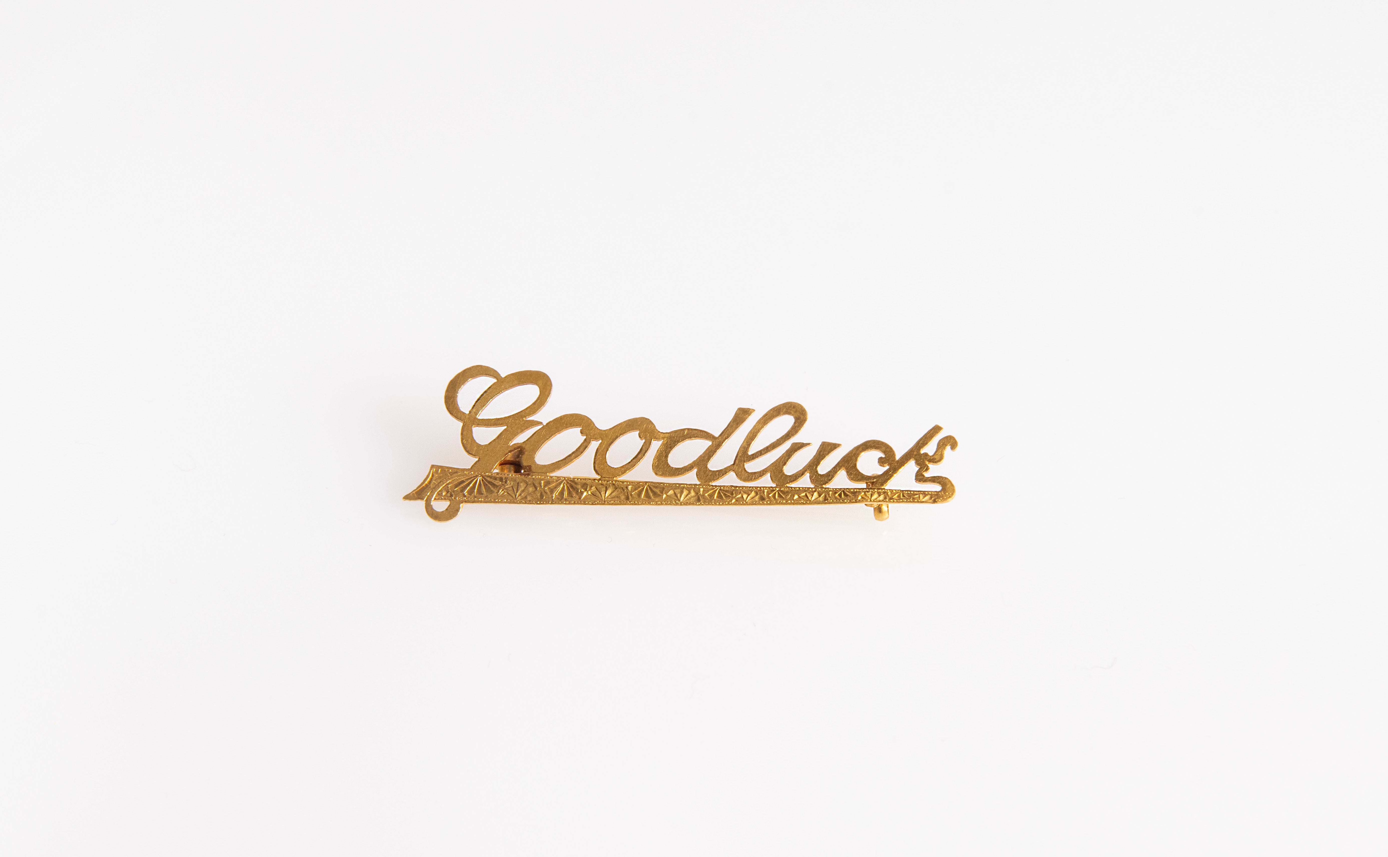 Vintage gold pin, front view