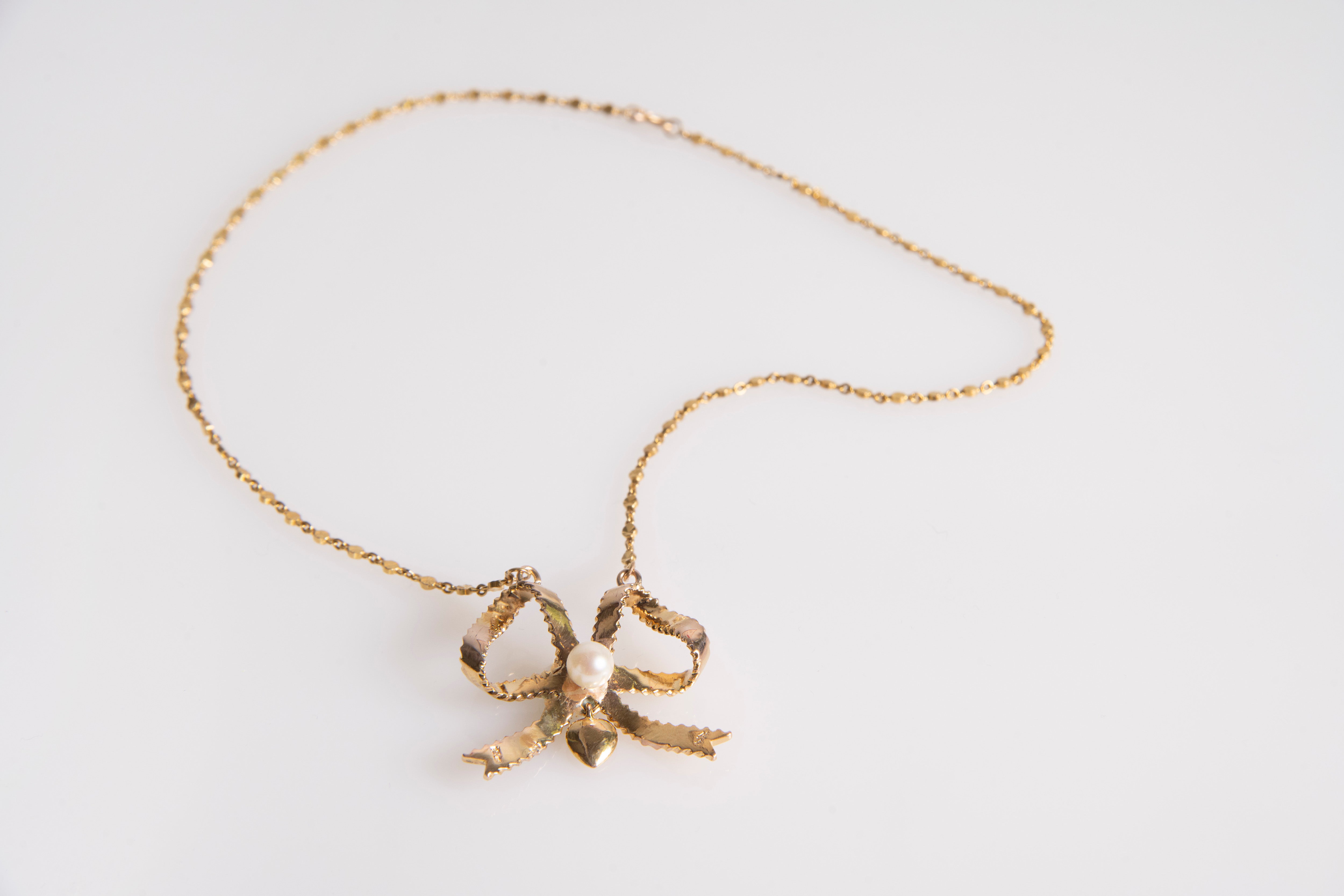 Vintage necklace with gold bow, front view