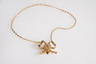 Vintage bow necklace with diamonds, front view 