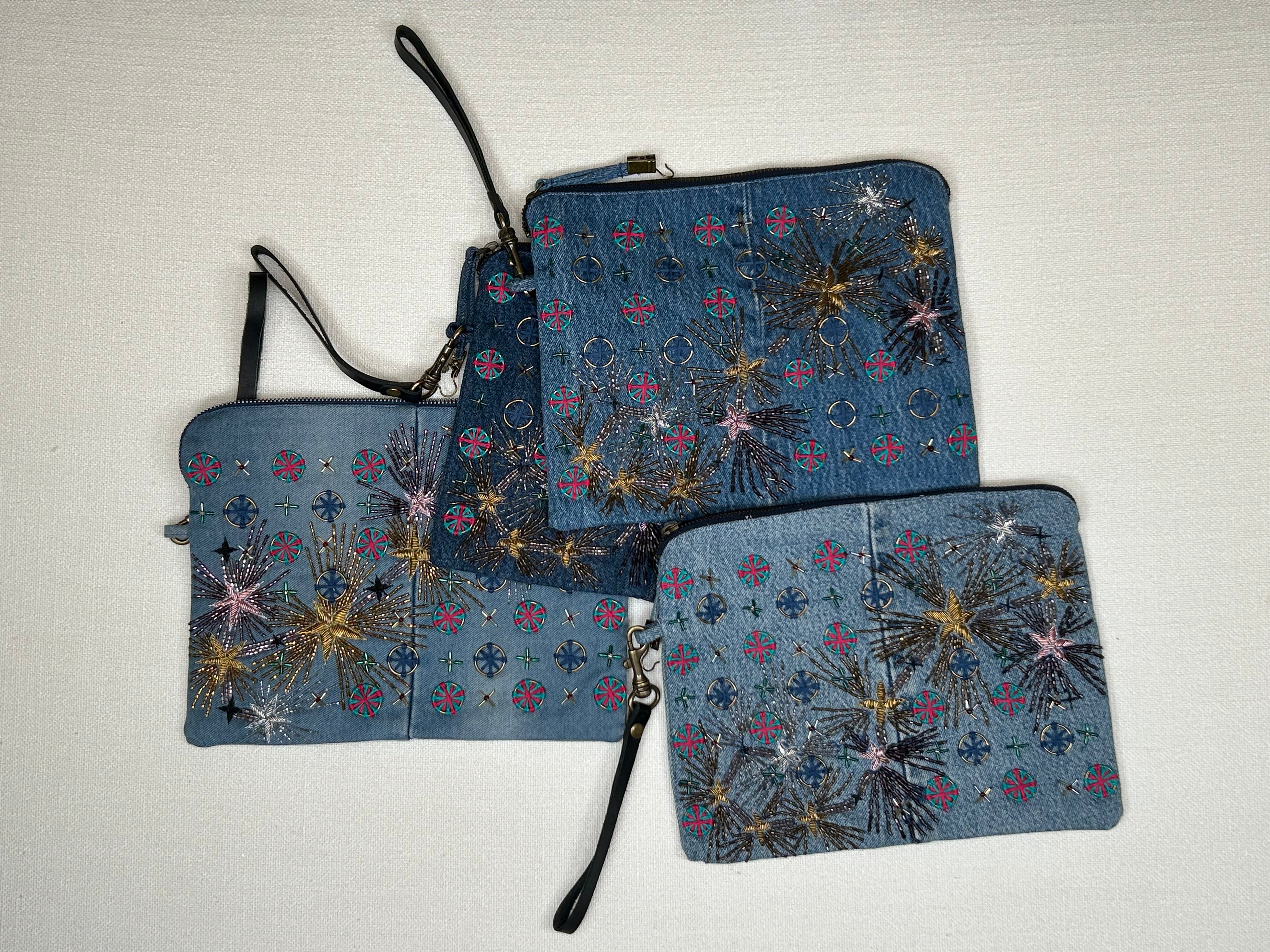 Pouch with embroidered embellishments, group view