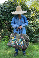 Upcycled aviator bag with embroidered embellishments, front view 