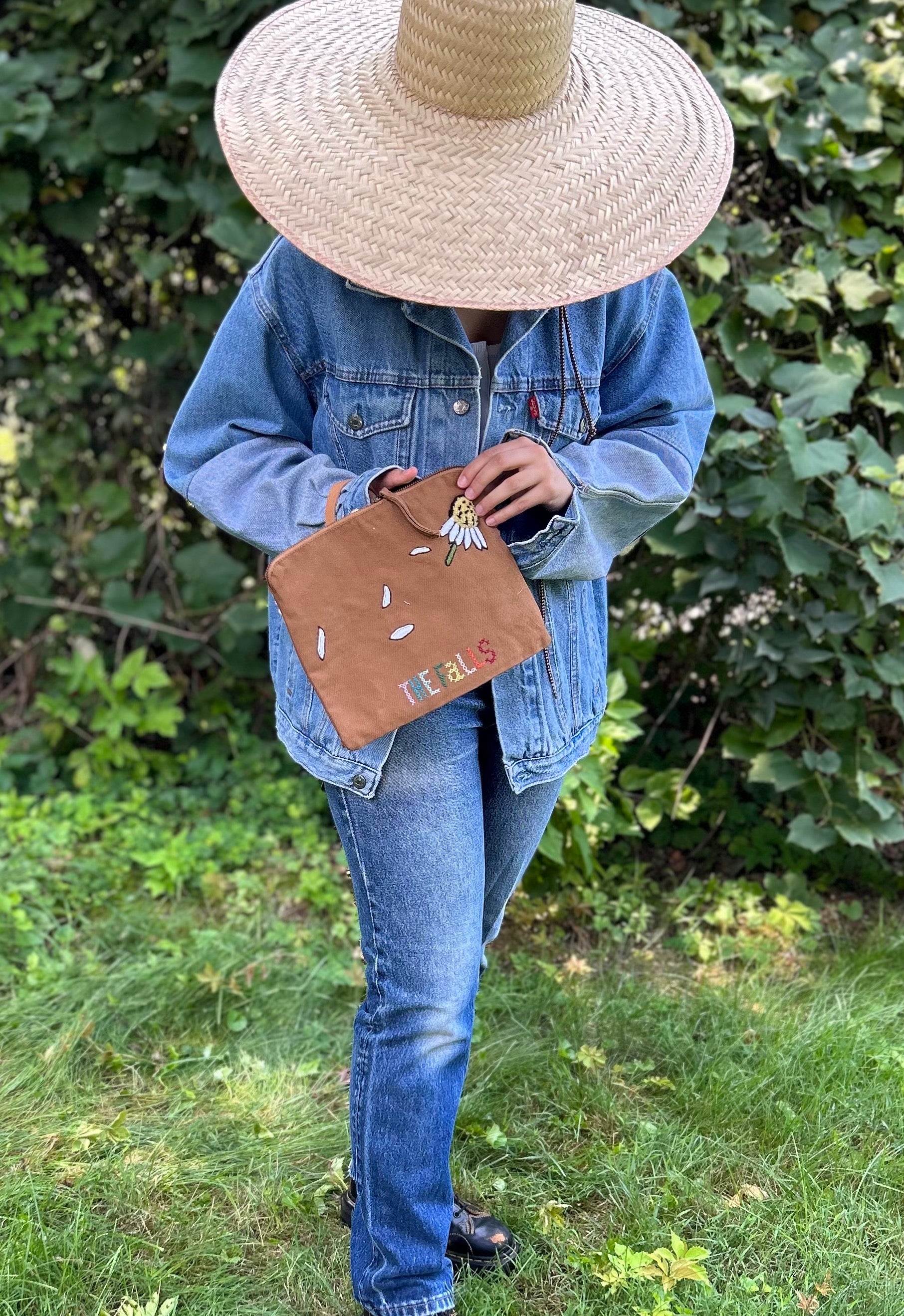 Pouch with embroidered and button embellishments, back view