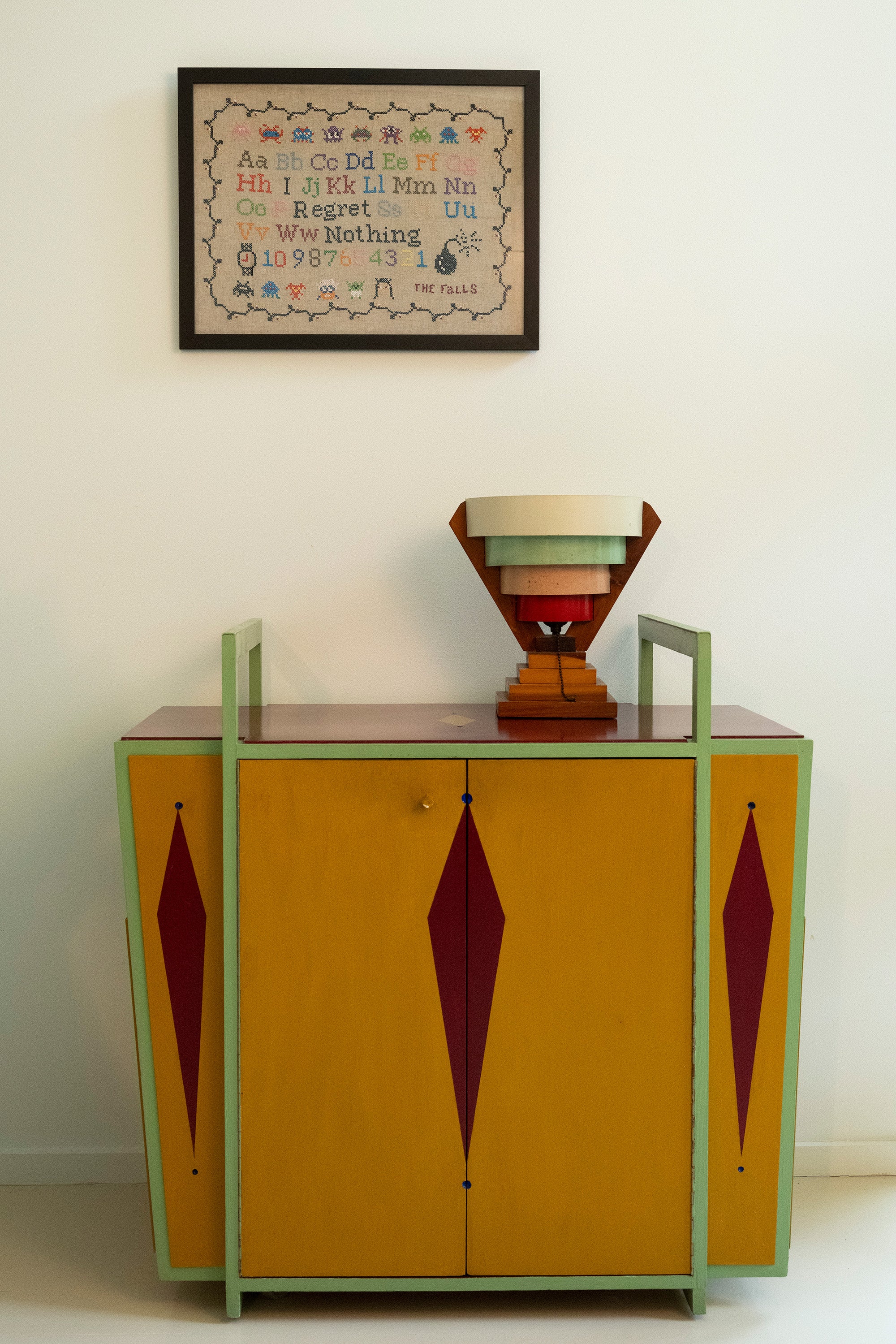 Upcycled framed sampler, room view 