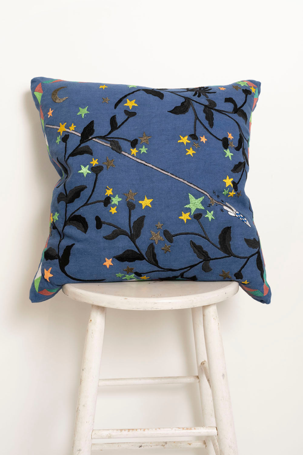 Pillow with embroidery embellishments, front view 
