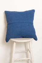Pillow with embroidery embellishments, back view 