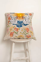 Pillow with embroidery and tufting embellishments, front view 