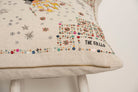 Pillow with embroidery embellishments, close up view 