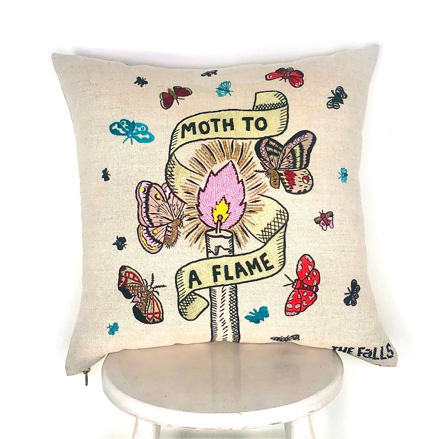 Pillow with embroidery embellishments, front view 