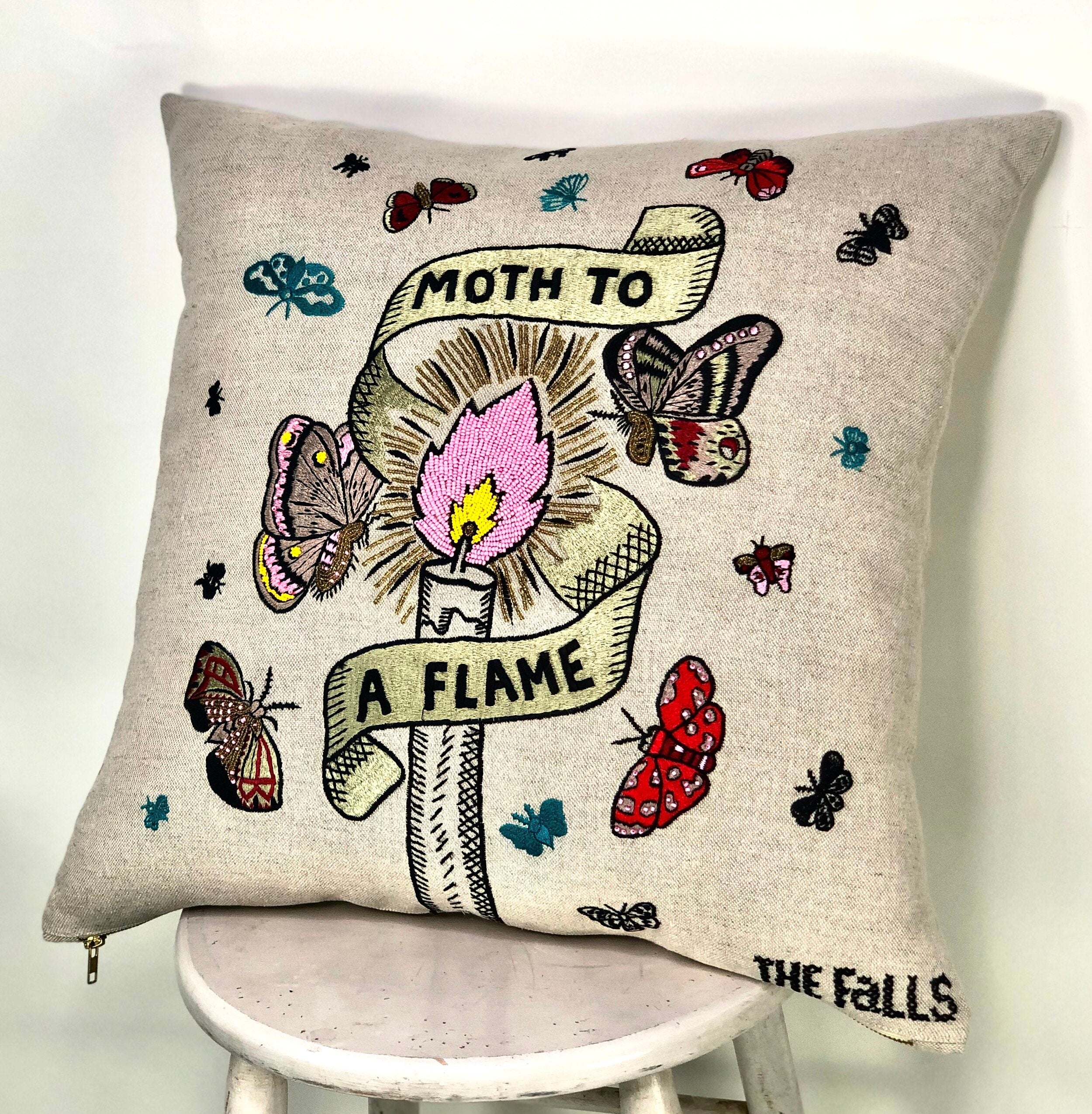 Pillow with embroidery embellishments, side view 