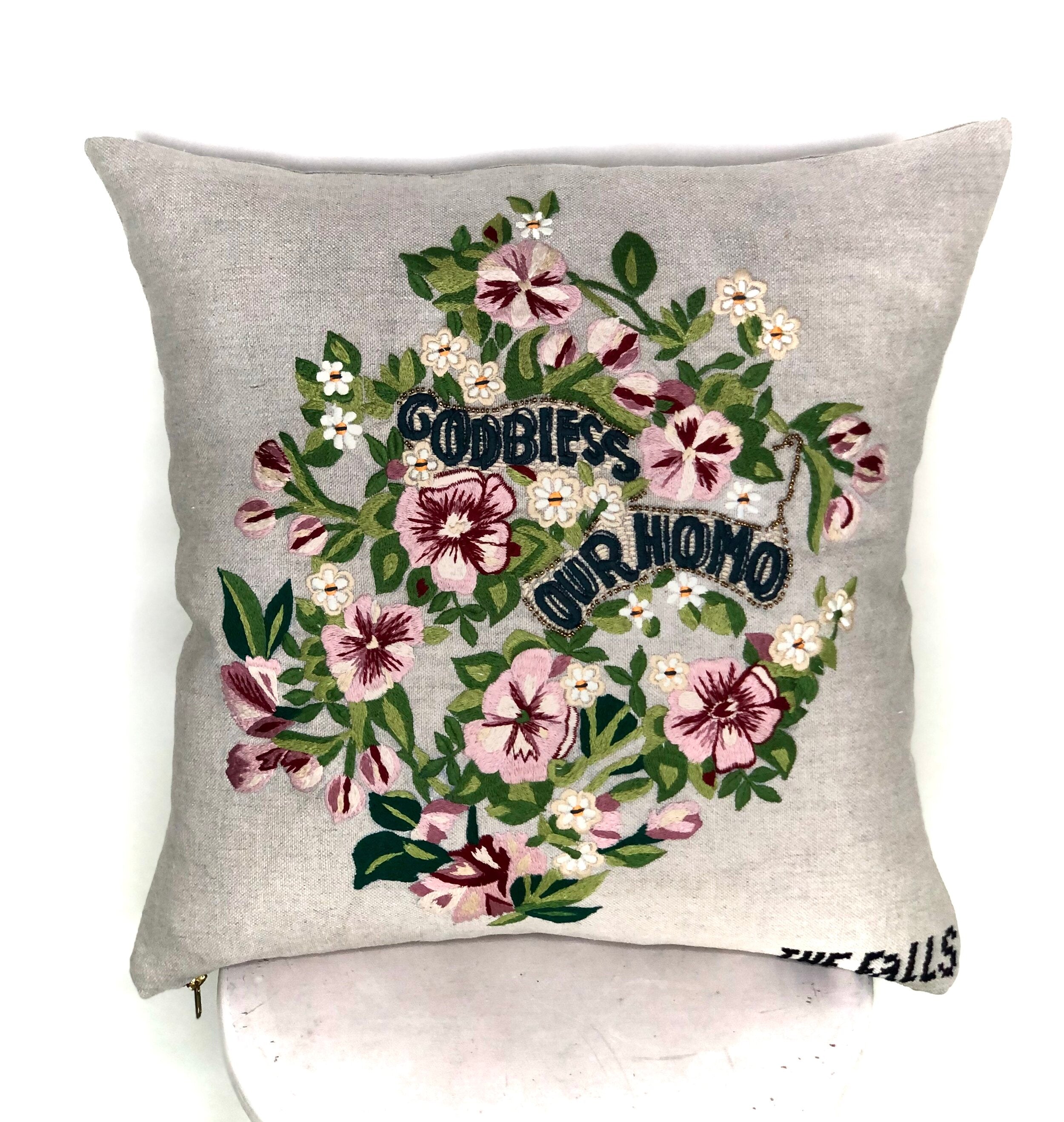 Pillow with embroidery embellishments, front view 