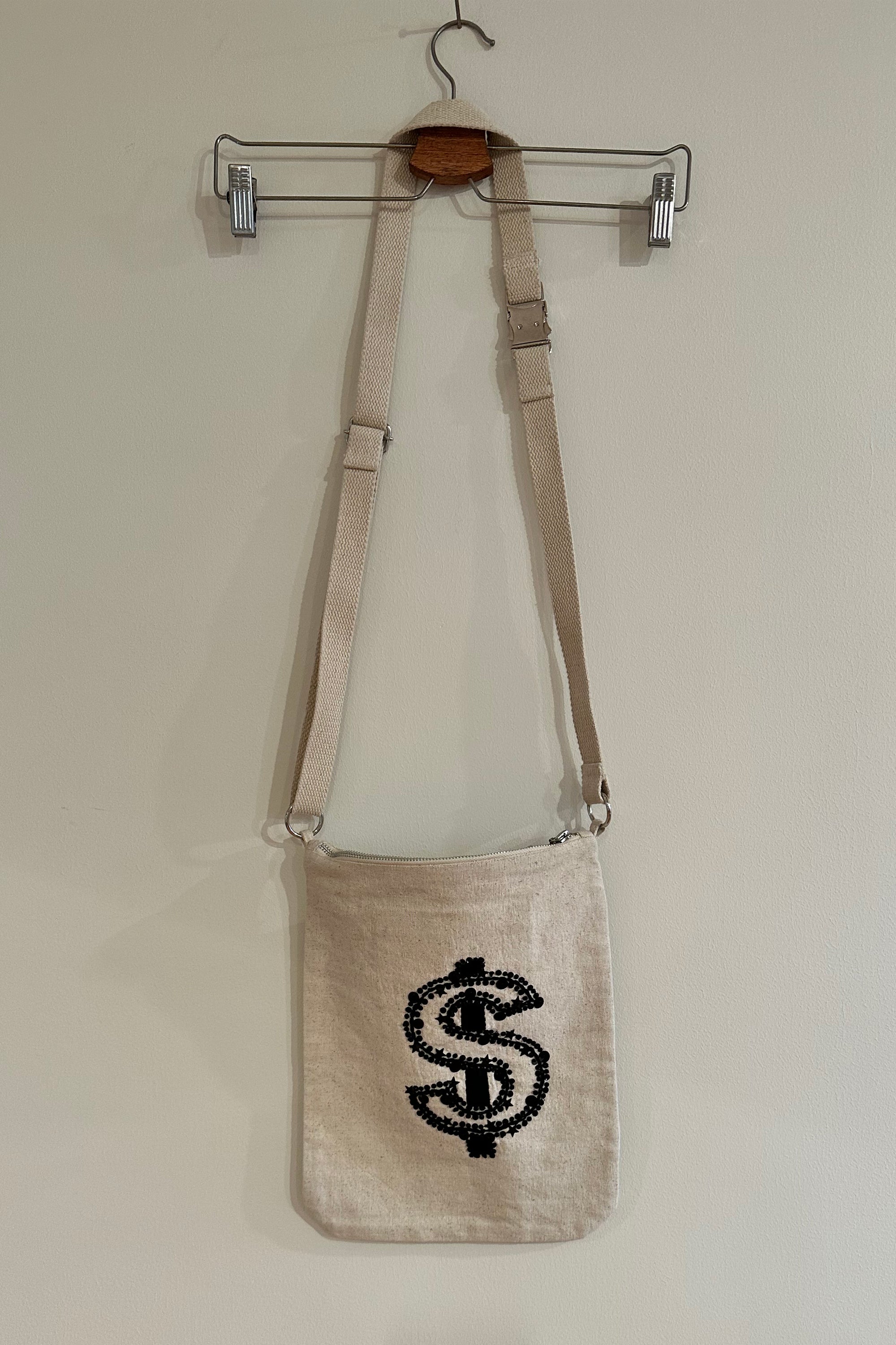 Embellished bag with money sign, back view 