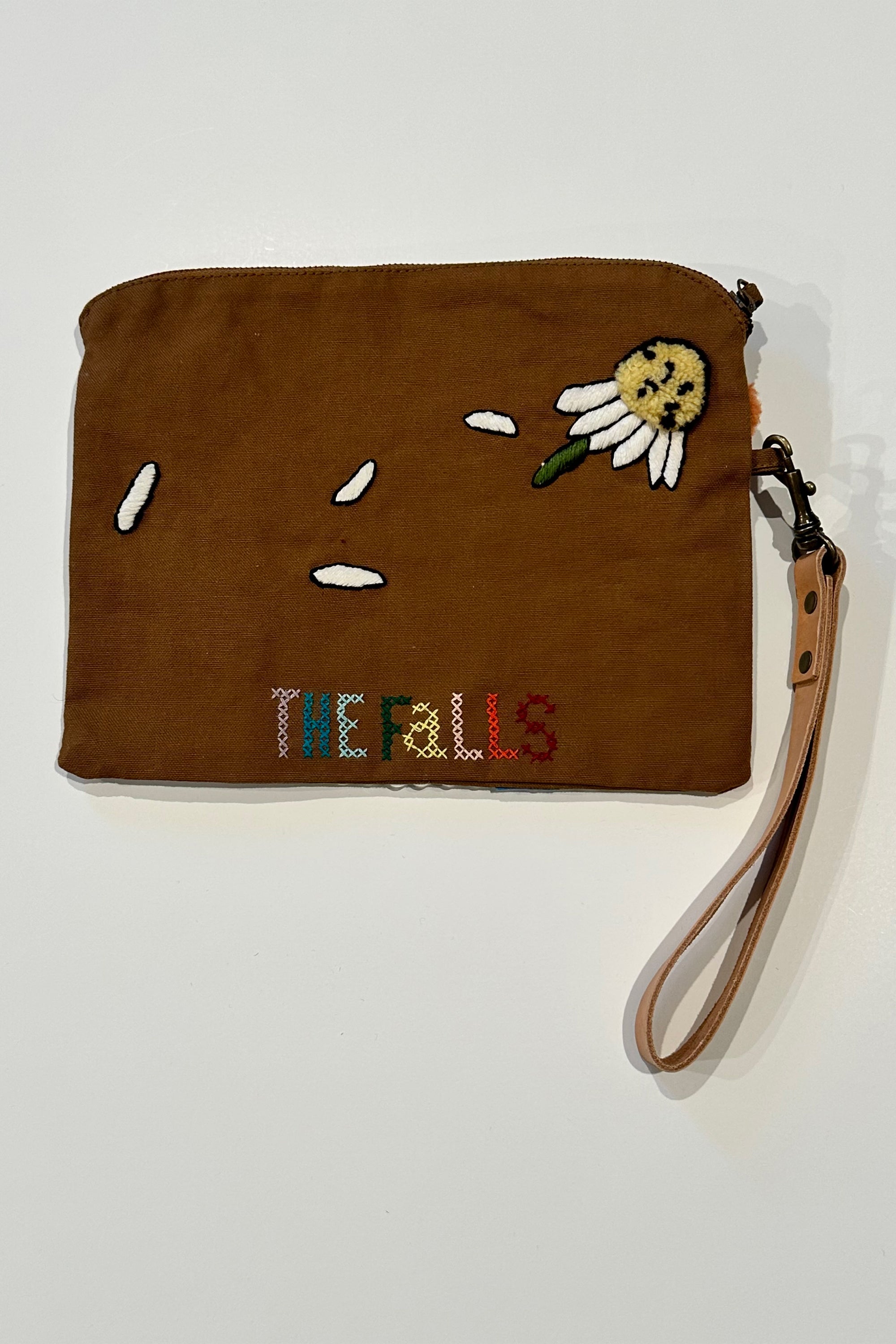 Pouch with embroidered and button embellishments, back view